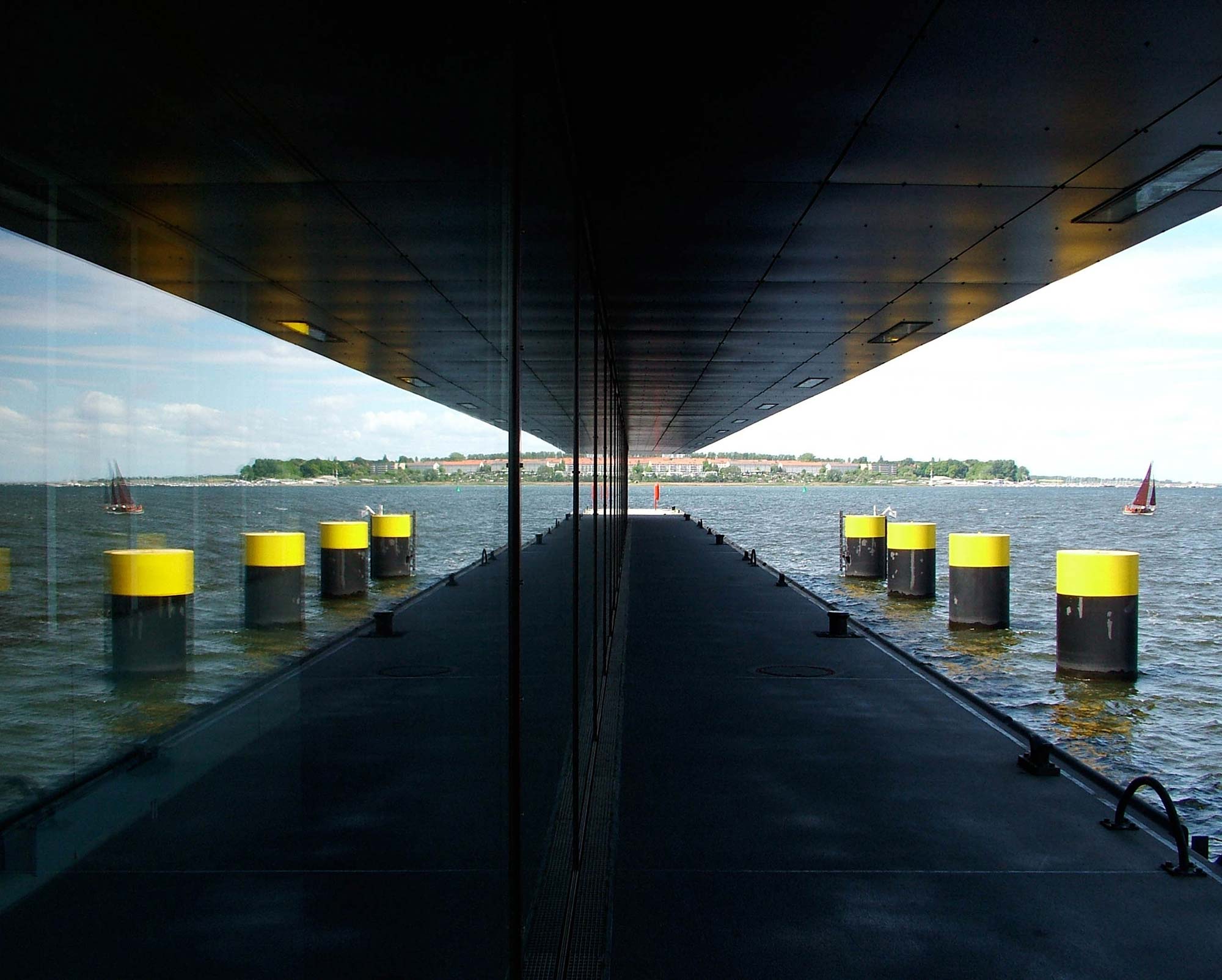 View from beneath a building overhang across the water in Wismar